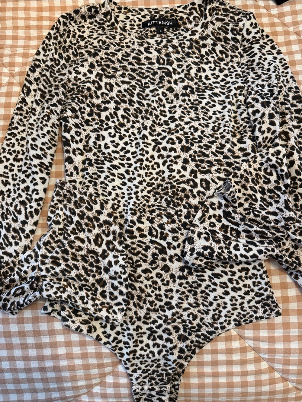 Kittenish Black and White Leopard Print Long Sleeve Bodysuit